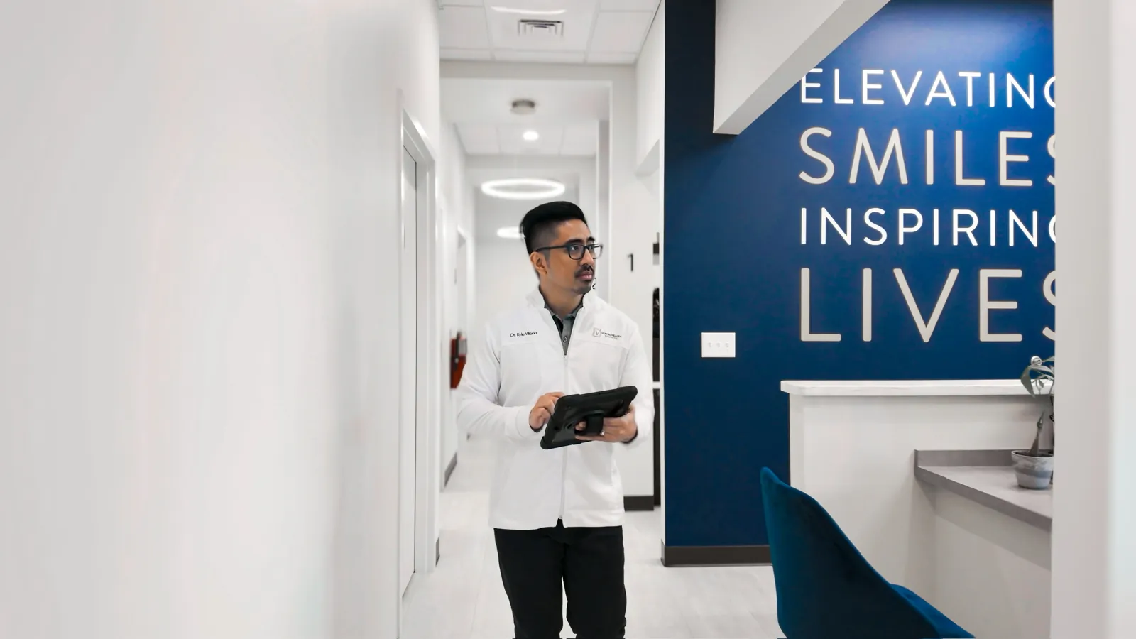 Dr. Kyle Viloria in the office corridor